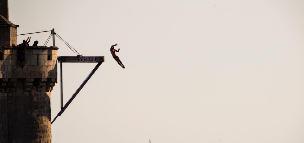 Artem Silchenko of Russia dives from the 27 metre platform on the Saint Nicolas Tower during the fourth stop of the Red Bull Cliff Diving World Series in La Rochelle, France on July 23, 2016.